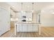 Kitchen with a center island, granite countertops, and white cabinets at 1067 Fairhaven Dr # 53, Mebane, NC 27302