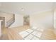 A spacious living room with a staircase and an open concept kitchen at 1067 Fairhaven Dr # 53, Mebane, NC 27302