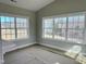 Bright living room featuring large windows offering scenic outdoor views at 1067 Fairhaven Dr # 53, Mebane, NC 27302