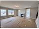 Spacious living room with a fireplace and large windows for natural light at 1067 Fairhaven Dr # 53, Mebane, NC 27302