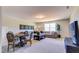 Comfortable living room featuring a game table, sectional sofa and large window at 1067 Fairhaven Dr # 53, Mebane, NC 27302
