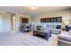 Spacious living room featuring sectional sofa, game table and wall art at 1067 Fairhaven Dr # 53, Mebane, NC 27302