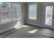 Naturally lit living room with a glass door and windows, showing outdoor views at 1067 Fairhaven Dr # 53, Mebane, NC 27302