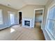 Bright living room with a fireplace and windows that offer natural light at 1067 Fairhaven Dr # 53, Mebane, NC 27302