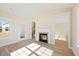 Bright living room features fireplace and hardwood floors at 1067 Fairhaven Dr # 53, Mebane, NC 27302