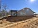 New construction shows a gray vinyl siding and views of a private backyard at 1067 Fairhaven Dr # 53, Mebane, NC 27302