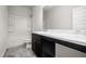 Bathroom featuring a shower-tub combo and a marbled vanity at 111 E Victory View Ter, Smithfield, NC 27577