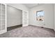 Versatile office space with carpet, large window, and glass doors at 111 E Victory View Ter, Smithfield, NC 27577