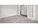 Carpeted office area featuring glass paneled doors and large windows at 111 E Victory View Ter, Smithfield, NC 27577