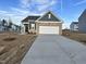 Charming single-Gathering home featuring a two-car garage and a combination brick and gray siding at 1115 Centerview, Nashville, NC 27856