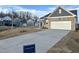 Inviting curb appeal with a well-manicured lawn and a long driveway leading to an attached garage at 1115 Centerview, Nashville, NC 27856