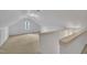 Finished attic space with white walls and natural light from window at 113 Bonner Ct, Cary, NC 27511