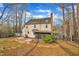 Spacious backyard featuring a screened-in porch and mature trees at 113 Bonner Ct, Cary, NC 27511