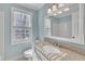 Cozy bathroom featuring a vanity with granite countertop and natural light from the window at 113 Bonner Ct, Cary, NC 27511