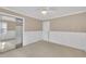 Neutral bedroom with carpet, chair-rail detail, and a mirrored closet at 113 Bonner Ct, Cary, NC 27511