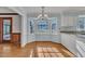 Bright breakfast nook with hardwood floors and a large bay window overlooking the yard at 113 Bonner Ct, Cary, NC 27511