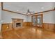 Cozy living room featuring a brick fireplace, ceiling fan and access to outside at 113 Bonner Ct, Cary, NC 27511