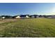 Grassy backyard surrounded by neighboring homes at 12 Flatland Dr, Princeton, NC 27569