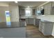 Modern kitchen boasting gray cabinets, granite countertops, a stylish backsplash, and stainless steel appliances at 12 Flatland Dr, Princeton, NC 27569