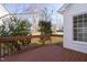 Relaxing back porch with stained wood railings offers serene views of the neighborhood at 1204 Matthews Glen Dr, Knightdale, NC 27545