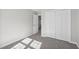 Cozy bedroom featuring plush carpeting, neutral walls, and spacious closet at 1204 Matthews Glen Dr, Knightdale, NC 27545