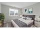 Cozy bedroom with a large bed, soft lighting, and stylish decor at 1204 Matthews Glen Dr, Knightdale, NC 27545