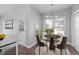 Bright breakfast nook with a round table, four chairs, and natural light at 1204 Matthews Glen Dr, Knightdale, NC 27545