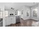 Open kitchen with stainless steel appliances, white cabinets, and a breakfast nook area at 1204 Matthews Glen Dr, Knightdale, NC 27545