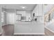 Kitchen view of stainless steel refrigerator and granite countertops at 1204 Matthews Glen Dr, Knightdale, NC 27545