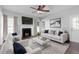 Cozy living room with a fireplace, modern furniture, and ample natural light at 1204 Matthews Glen Dr, Knightdale, NC 27545