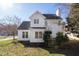 Side and back view of home and yard with mature trees at 1204 Matthews Glen Dr, Knightdale, NC 27545