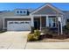 Charming home with a two-car garage, well-maintained lawn, and neutral-colored exterior at 1216 Blue Mist Ct, Apex, NC 27502