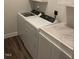 Convenient laundry area featuring a washer, dryer, and folding counter at 1216 Blue Mist Ct, Apex, NC 27502