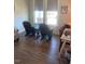 Cozy living room features hardwood floors, large windows, and comfortable seating at 1216 Blue Mist Ct, Apex, NC 27502