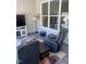 Relaxing sunroom featuring plush seating, a TV, and large windows at 1216 Blue Mist Ct, Apex, NC 27502
