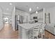 Bright kitchen featuring stainless steel appliances, a center island and barstool seating at 123 Liam St, Clayton, NC 27520