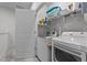 Bright laundry room featuring a washer, a dryer, and white walls at 123 Liam St, Clayton, NC 27520