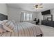 Bright main bedroom featuring large windows, a ceiling fan, and an office space at 123 Liam St, Clayton, NC 27520