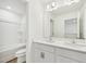 Clean, bright bathroom with double sink vanity, tub, and toilet at 124 Willow Cameron Way, Angier, NC 27501