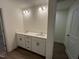 A bathroom with a double sink vanity and white shaker cabinets at 124 Willow Cameron Way, Angier, NC 27501