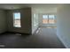 A bedroom with two large windows and neutral color carpet at 124 Willow Cameron Way, Angier, NC 27501