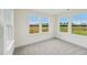 Cozy bedroom with plush carpeting and large windows offering scenic views at 124 Willow Cameron Way, Angier, NC 27501