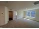 A bedroom with neutral carpet and natural lighting from two windows at 124 Willow Cameron Way, Angier, NC 27501