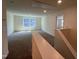 A bonus room with carpet, windows, and natural lighting at 124 Willow Cameron Way, Angier, NC 27501