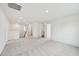 Open bonus room with new carpeting, recessed lighting, and convenient access to other rooms at 124 Willow Cameron Way, Angier, NC 27501