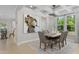 Elegant dining room with coffered ceiling, stylish chandelier, and ample natural light at 124 Willow Cameron Way, Angier, NC 27501