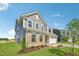 Charming two-story home with brick and siding, landscaped yard, and attached two-car garage at 124 Willow Cameron Way, Angier, NC 27501