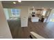 A kitchen with modern appliances, wood flooring, and a center island is shown at 124 Willow Cameron Way, Angier, NC 27501