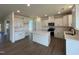 Kitchen area with white cabinets, a large island with a white countertop, and stainless steel appliances at 124 Willow Cameron Way, Angier, NC 27501