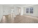 Bright living room with hardwood floors, neutral paint, and views into the foyer and adjacent rooms at 124 Willow Cameron Way, Angier, NC 27501